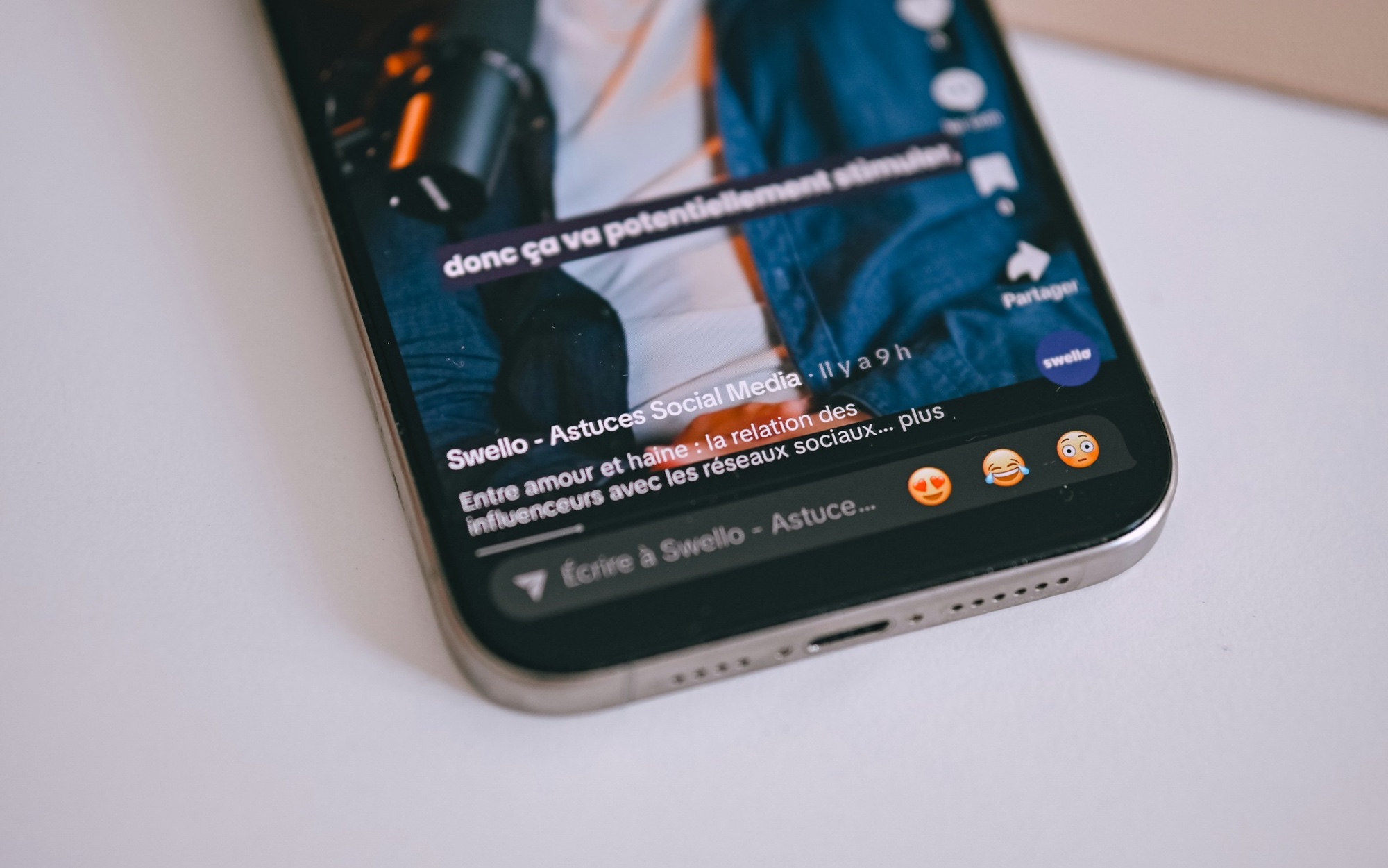 A real smartphone displaying a vertical social media video feed and interface controls